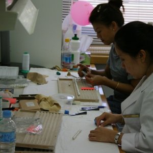 Stringing pearls at Paspaley's sorting facility.