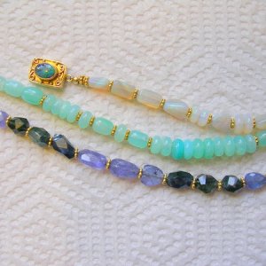some gem bracelets I amde.
opals.. nice 18k clasp! hard to show the colors in pics!!
Pretty peruvian opals and gold
large funky blue sapphires and tanzanite!