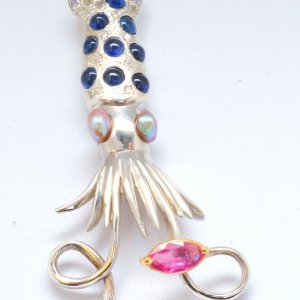 squid pendant with abalone pearls, sapphires and diamonds on white gold.