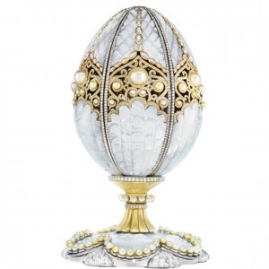 The First Imperial Faberge Pearl Egg 

Of course this does not qualify as ancient. I is historical. 

According to FabergÃ© records 50 eggs in total were commissioned by the Russian Imperial family over two generations, and 43 of them survived the Russian Revolution.
The last Imperial egg to be auctioned reportedly went for more than $30 million when sold last year after being found in a jumble sale. And the last officially known price for an egg was $18.5 million, which was sold at Christieâs in London