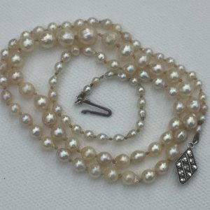 Pearl strand is 22” long,largest pearl1/4inch,or 11mm