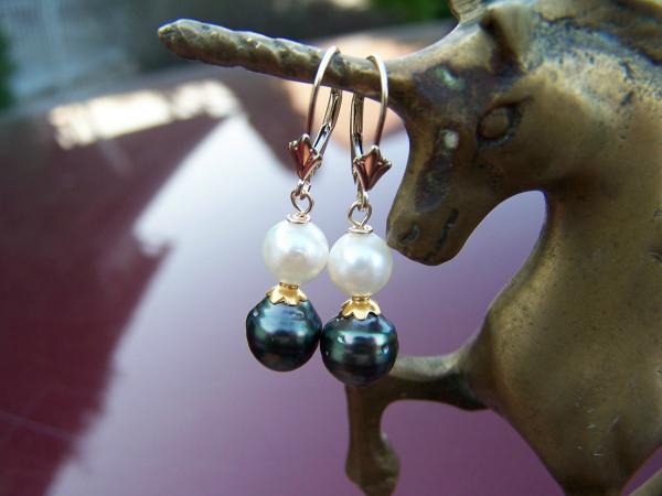 Evergreen Tahitian pearl earrings with akoya pearl on top.  Set on fleur de lis 14k leverbacks with 14k bali gold daisy caps between.