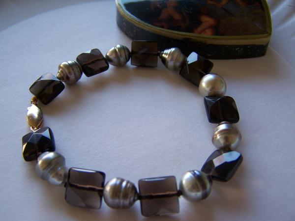 Silver and chocolate striped Tahitian Pearl bracelet with faceted smokey quartz.